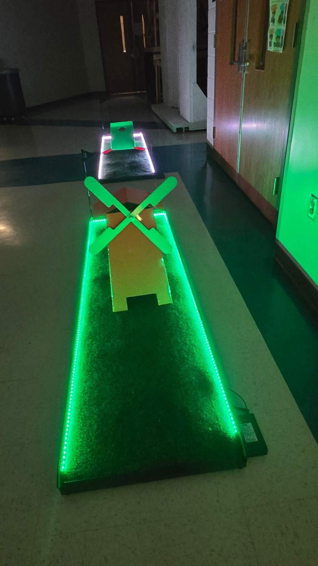 Putt Zone Texas mini-golf lane lit with LED lighting and a windmill obstacle